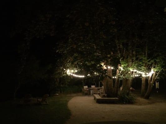 The patio area, lit up with lights at night! So cute.