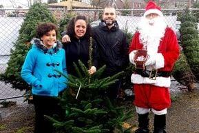 Santa sells some trees to the local community at L'arche