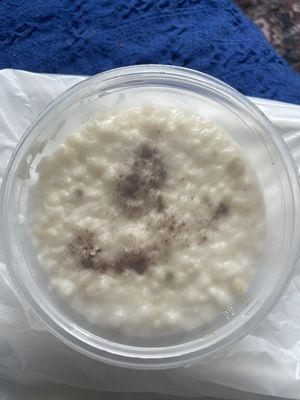 Moldy rice pudding in clear container