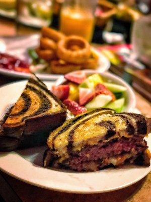 Patty melt (medium rare) with fruit and a bonus side of onion rings.