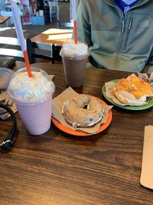 Strawberries n cream smoothie and a blueberry bagel. My boyfriend got a banana split with a better cheddar bagel