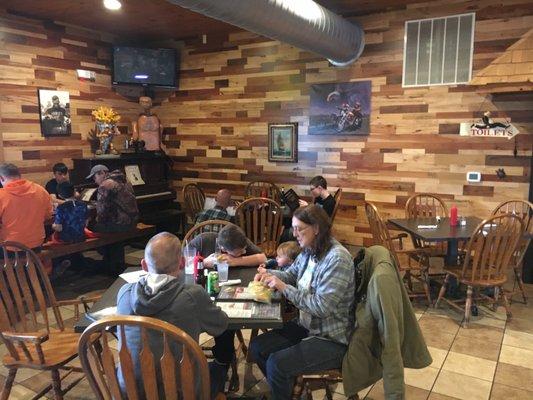 My family sitting at two tables because apparently putting tables together is a "fire hazard"??