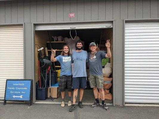 Josiah, Pablo, and William packing the storage unit like masters at Tetris!