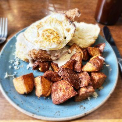 Charleston fried chicken biscuit with fried egg and home fries