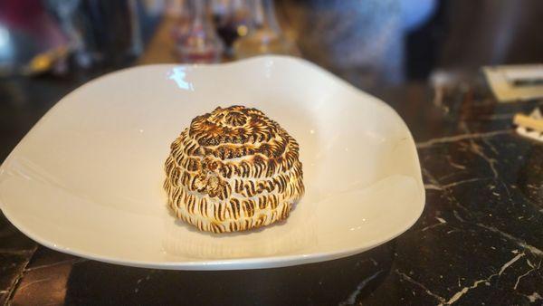 It's a beautiful mini Baked Alaska.  Perfect for the not too sweet palette,  you know who you are.