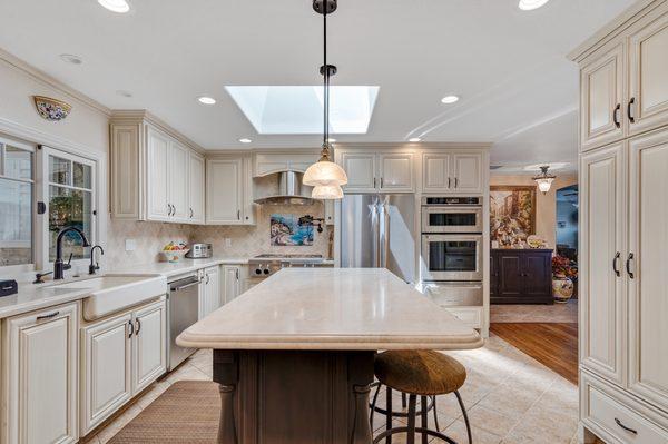 Removed a small wall to open up the kitchen and dining room and relocated the oven for a more functional kitchen layout.