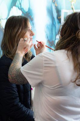 Makeup services being applied