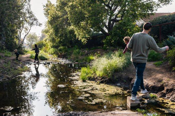 Family adventure crossing the river