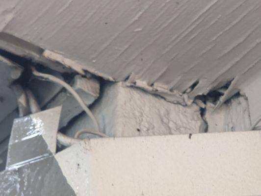 The ceiling separating from the balcony.