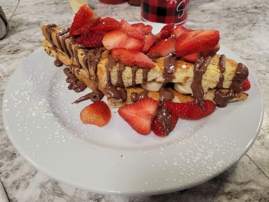 Nutella, banana, and strawberry stuffed French toast