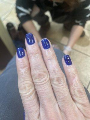 Electric blue gel nails.