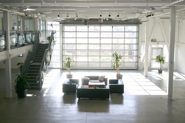 Looking south towards the 18' overhead door and grassy courtyard.