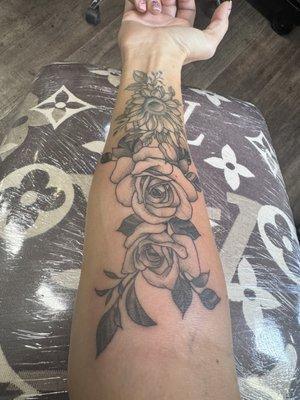 Jonathan added the roses to my sunflower tattoo!