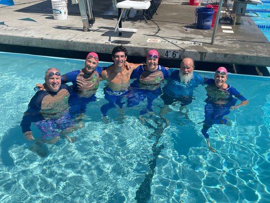 Our coaches are so awesome that they swim in their superhero costumes during the Coaches Relay at Champs