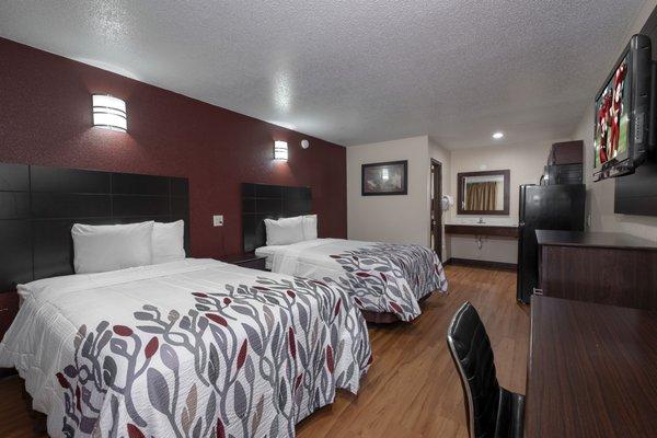 Two Queen beds with new bedding and wonderful wood-like flooring.