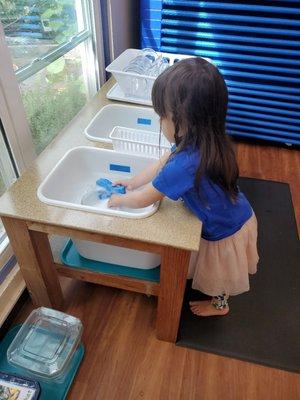 washing her own dishes