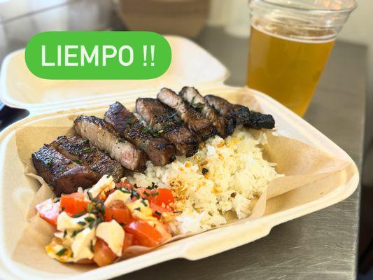 Liempo or BBQ Pork belly served with rice and tomato mixed with salted egg