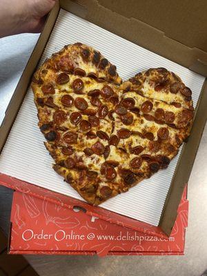 Heart shape pizza with pepperoni cups