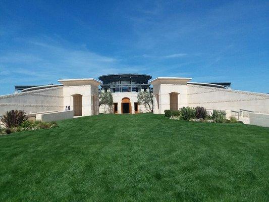 The glorious Opus 1 estate basking in blue skies, one of the best Rutherford wineries on the golden mile