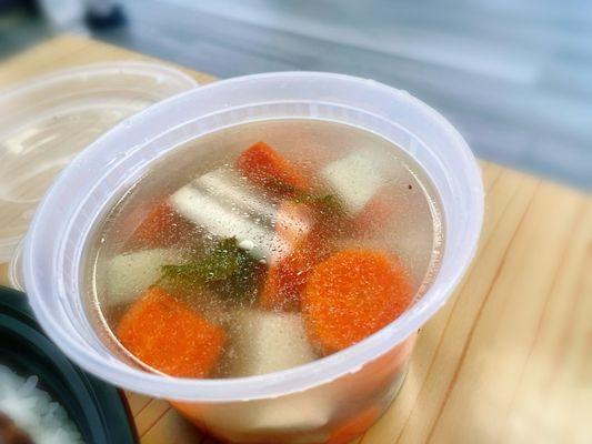 A soup that came with the rice plate. This one has small meatballs, carrots, potatoes, and some leafy greens.