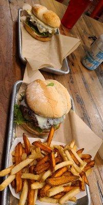 Two green chile burgers with a combo of mixed fries