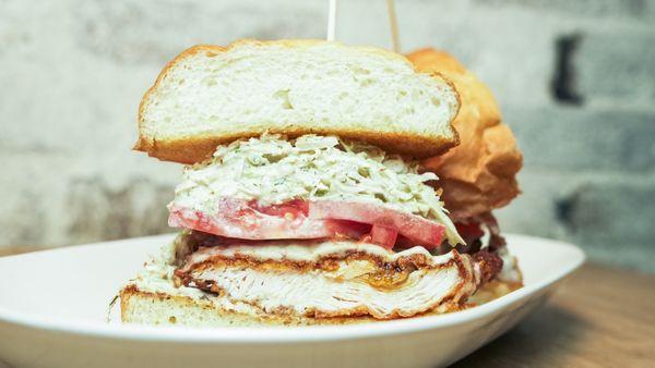 CRISPY CHICKEN SANDWICH - muenster, tomato, herbed buttermilk slaw