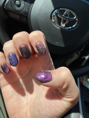 Galaxy nails and active glitter nail on ring finger. Cosmic Halloween themed.