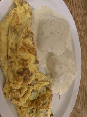 Bacon and cheese omelette with biscuits and gravy. (Not too cheesy)