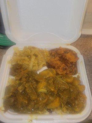 Half Curry goat & half oxtail over rice w/candied yams and cabbage  So yummy