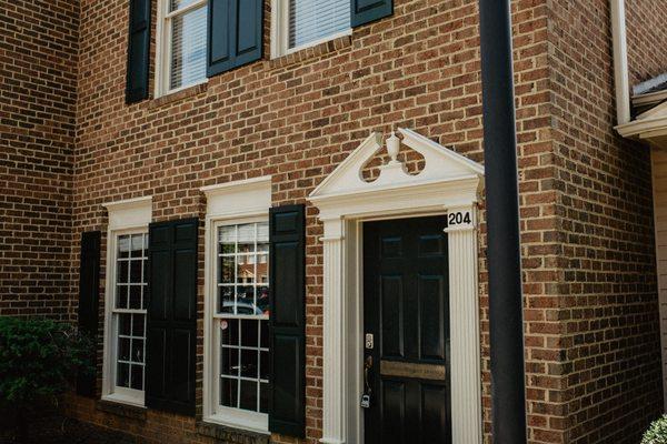 This is the outside of Salon Synchronicity. Come in the front door pictured here, and our secondary door will be located just to the left.