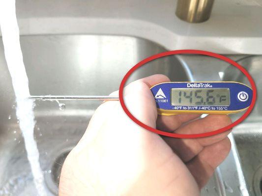 The temperature of this hot water is excessive.  The maximum recommended setting is 120 Degrees Fahrenheit.