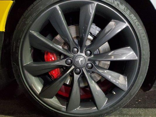 Full wheel repair and refinish. Red calipers custom painted.