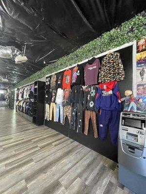 ATM and some clothes displaying on the wall.