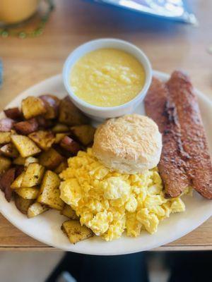 country breakfast  eggs scrambled with cheese so light and fluffy !!! sausage not too spicy and grits hot and full of butter !!! l