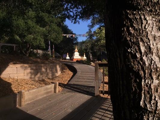 Looking back at the stupa from the deck of outdoor shower house