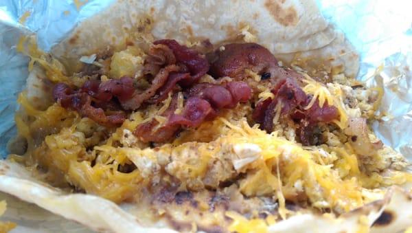 Handmade flour tortilla, egg, potato, chorizo, beans, bacon and cheese!