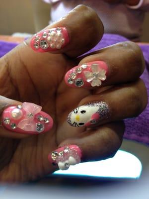 Hello kitty nails on the Left Hand