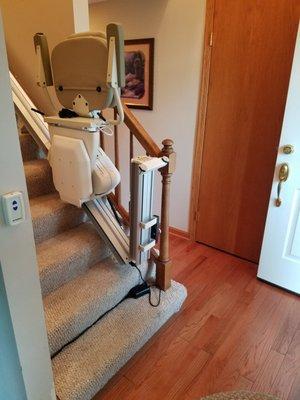 Stair lift with flip-up rail