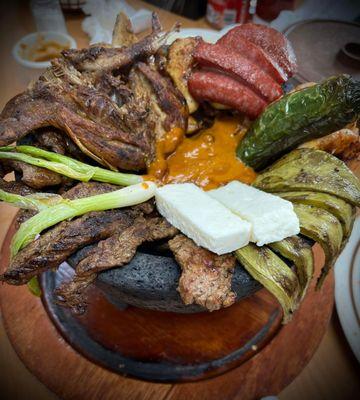 Parillada, beef fajita, queso fresco, sausage, beef rib, cactus, shrimp, and chicken