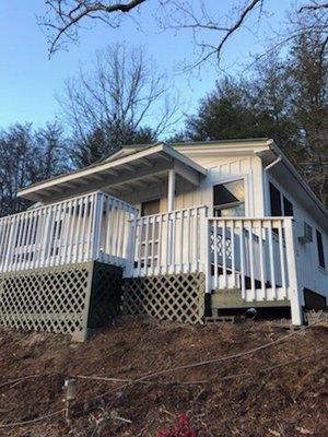 Full exterior paint including deck railings & flooring and replaced old wood lattice with new vinyl