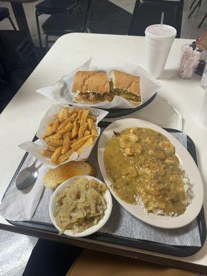 Shrimp ettoufee with grilled catfish. Cabbage on the side & a shrimp poboy