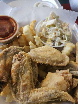 Perfectly seasoned and battered wing platter  with fries and slaw