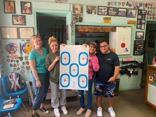 Proudly displaying targets after Beginner Handgun Class!