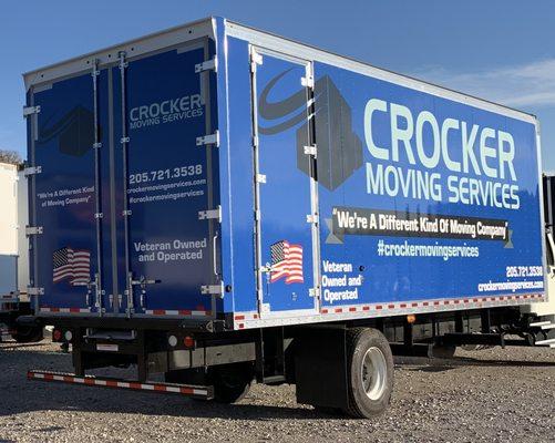 Our trucks have purpose-built moving boxes. Notice the "barn style" back doors and rear side door. Roll-up doors use space.