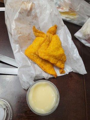 Crab Ragoons that taste like only cream cheese is inside with weird sauce