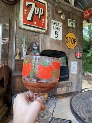 Enjoying a spicy Bloody Mary on their vintage furnished outdoor saloon.