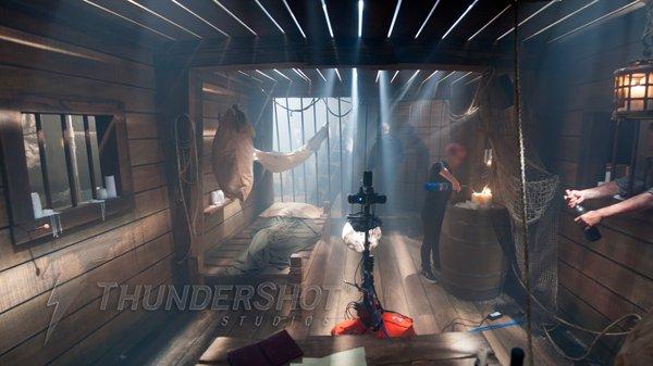 19th Century prison ship interior with moving rays of light.  360 degree virtual set built at ThunderShot Studios.