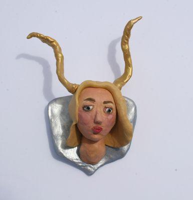 Trophy Wife, hanging wall sculpture by Carrie Goller