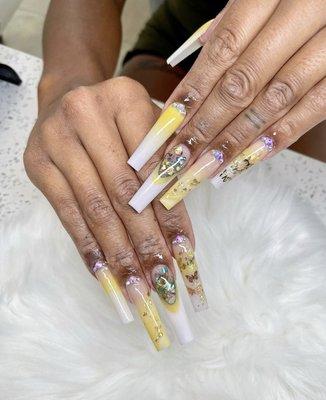 Yellow white ombré long coffin with butterfly details.