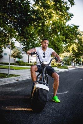 Young athletic man riding a Koto Bike